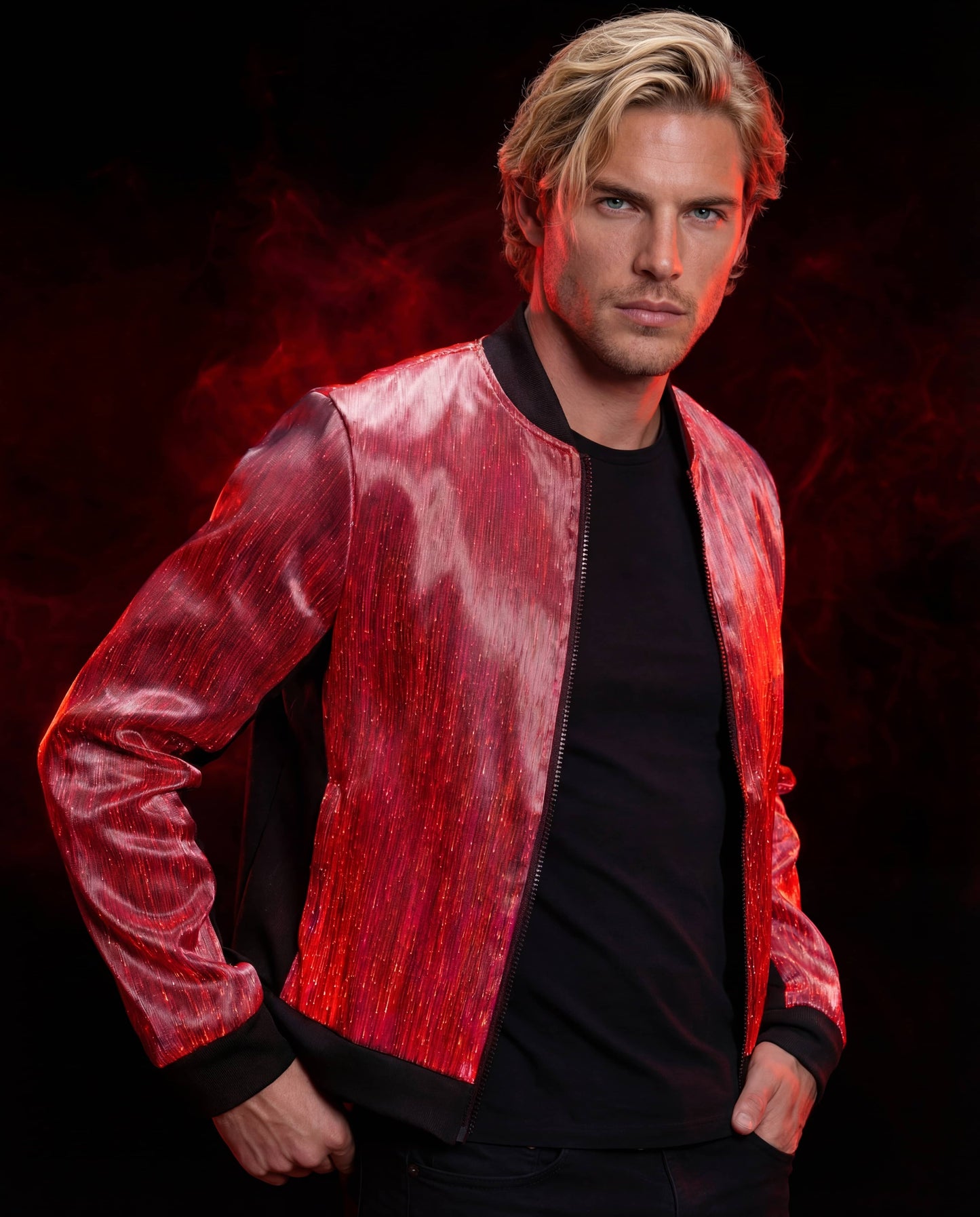 Man wearing a glowing red fiber-optic bomber jacket, standing against a dark red smoke-filled background