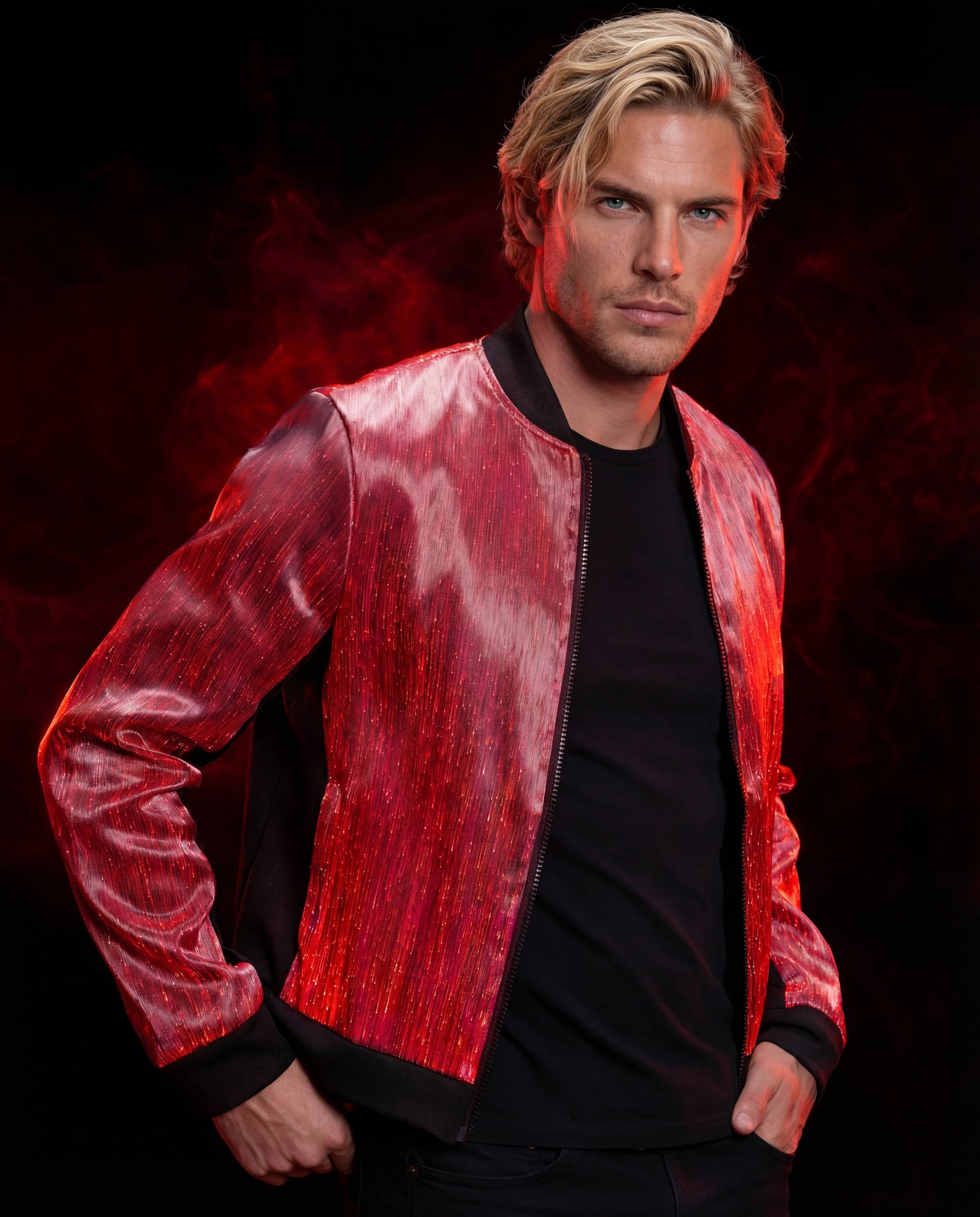 Man wearing a glowing red fiber-optic bomber jacket, standing against a dark red smoke-filled background
