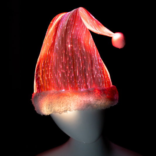 Fiber optic light-up Christmas hat illuminated in red and white on a mannequin head against a dark background