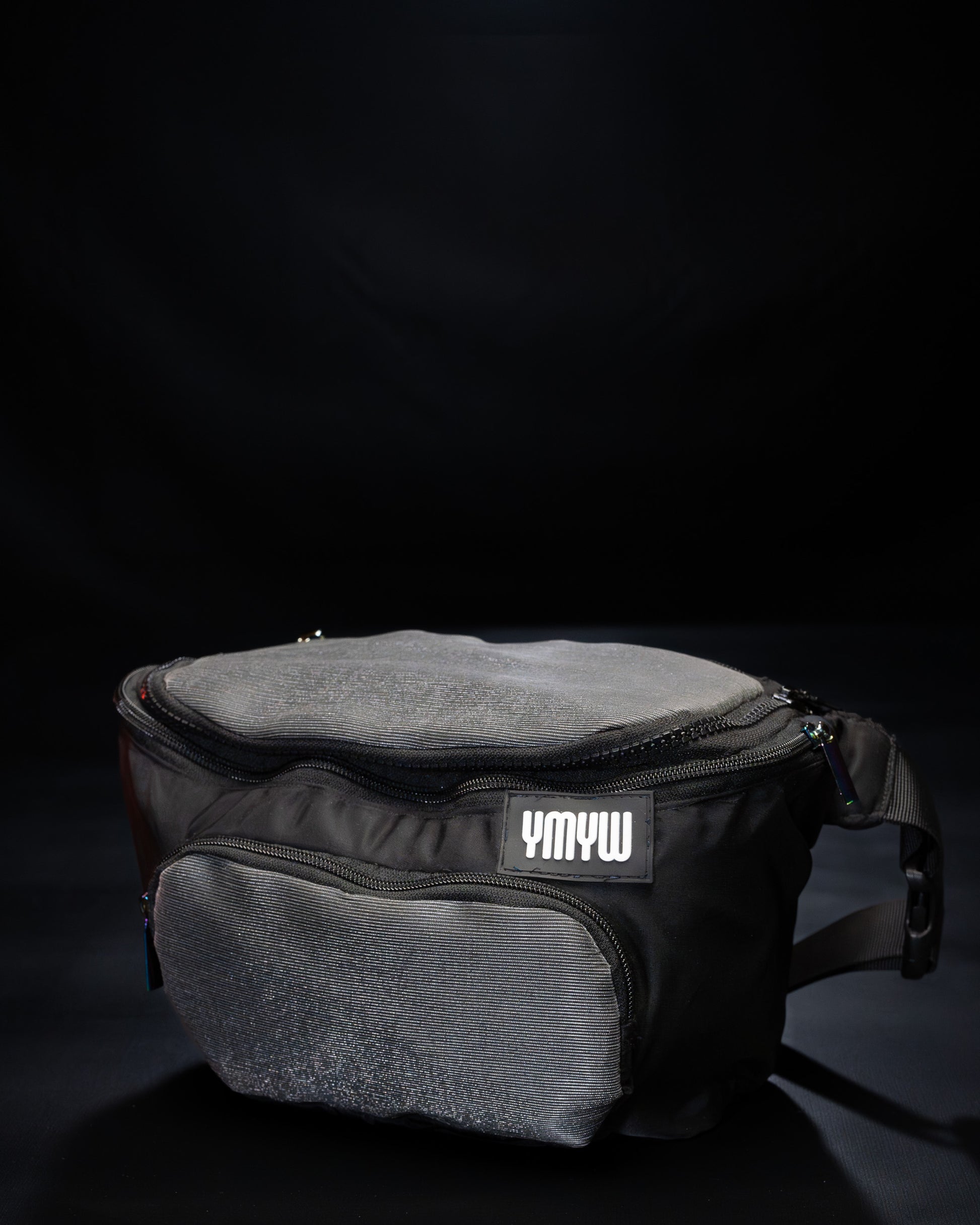 Unlit fiber optic light up waist bag showing "YMYW" logo on a dark background