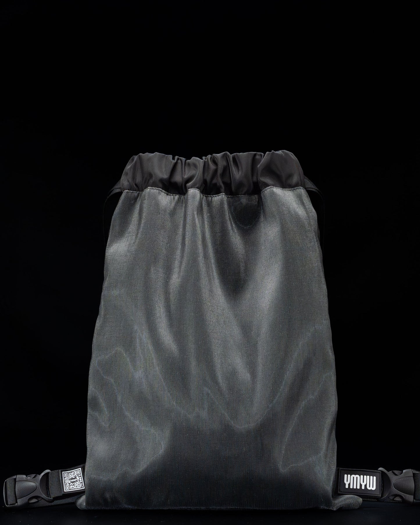 Black fiber optic drawstring backpack shown unlit, with ‘YMYW’ branding visible on a dark background