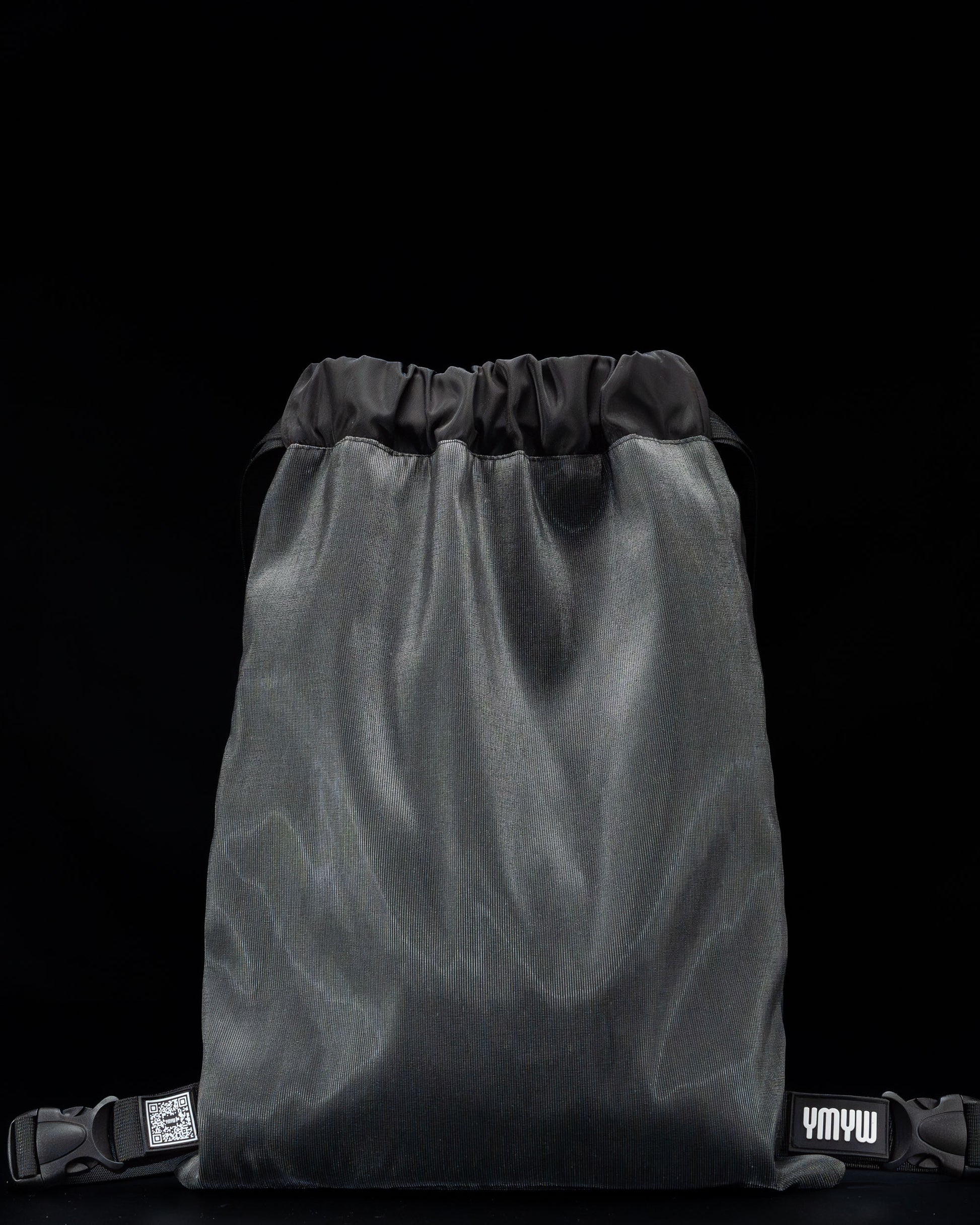 Black fiber optic drawstring backpack shown unlit, with ‘YMYW’ branding visible on a dark background