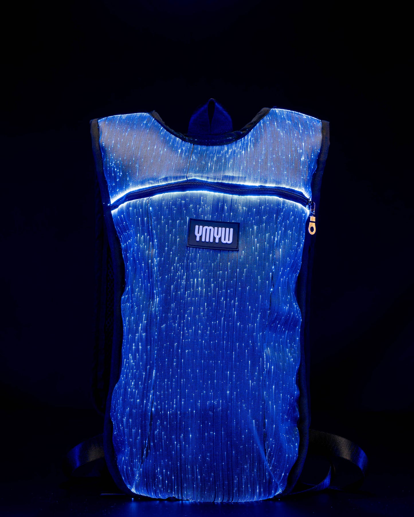 Fiber optic light up hydration backpack glowing in blue light with YMYW logo visible on a dark background