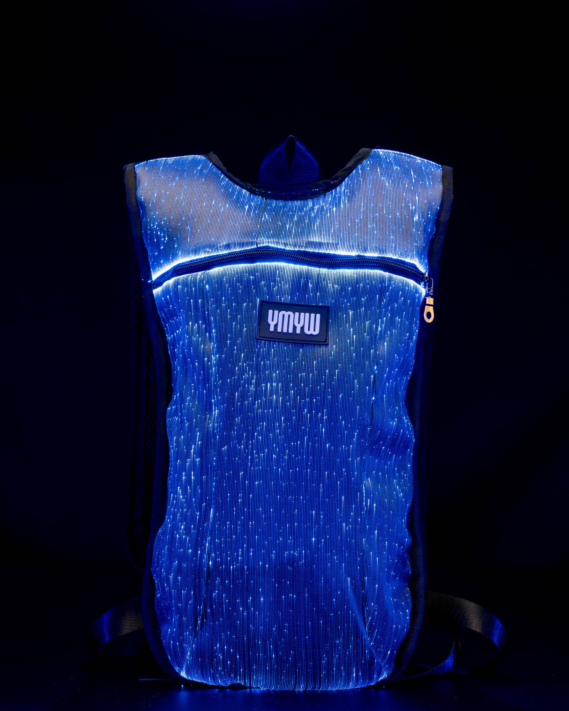 Fiber optic light up hydration backpack glowing in blue light with YMYW logo visible on a dark background