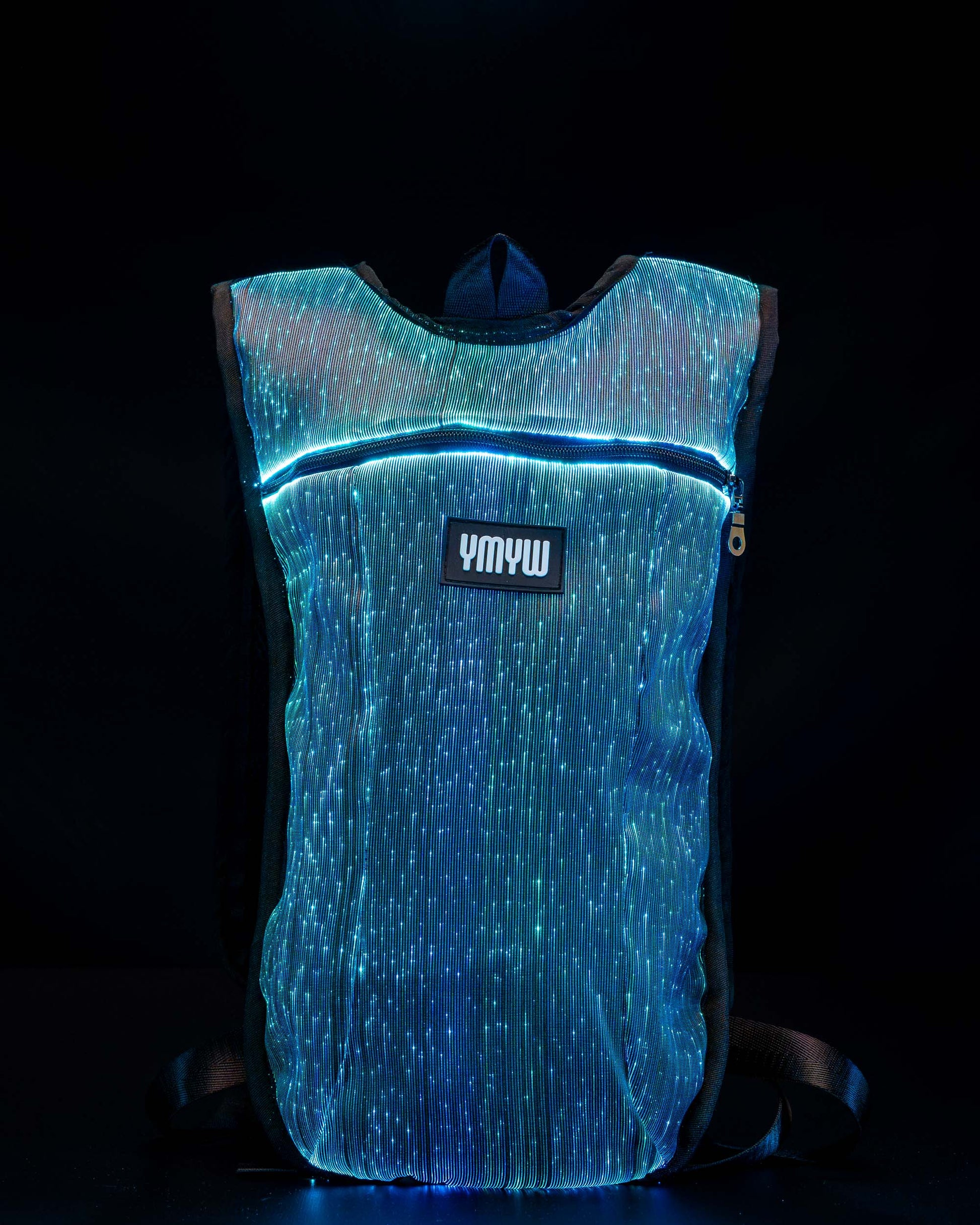 Fiber optic light up hydration backpack glowing in blue light with YMYW logo visible on a dark background