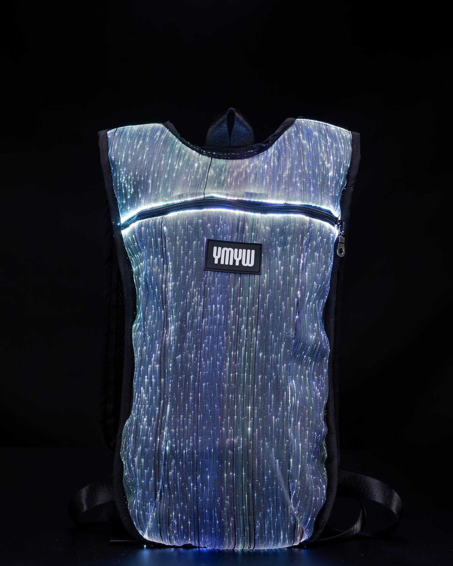 Fiber optic light up hydration backpack glowing in white light with YMYW logo visible on a dark background