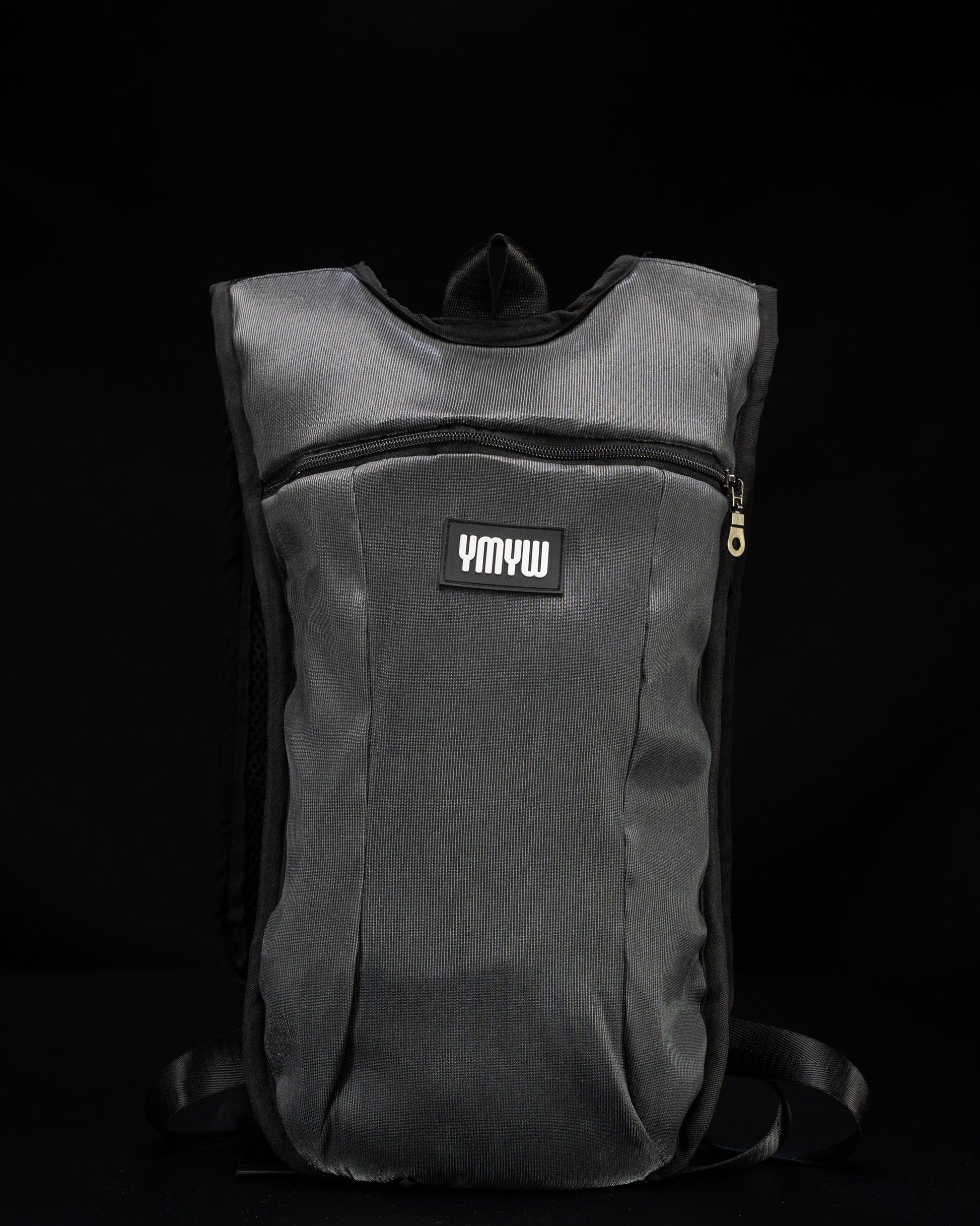 Unlit fiber optic light up hydration backpack showing YMYW logo on a dark background