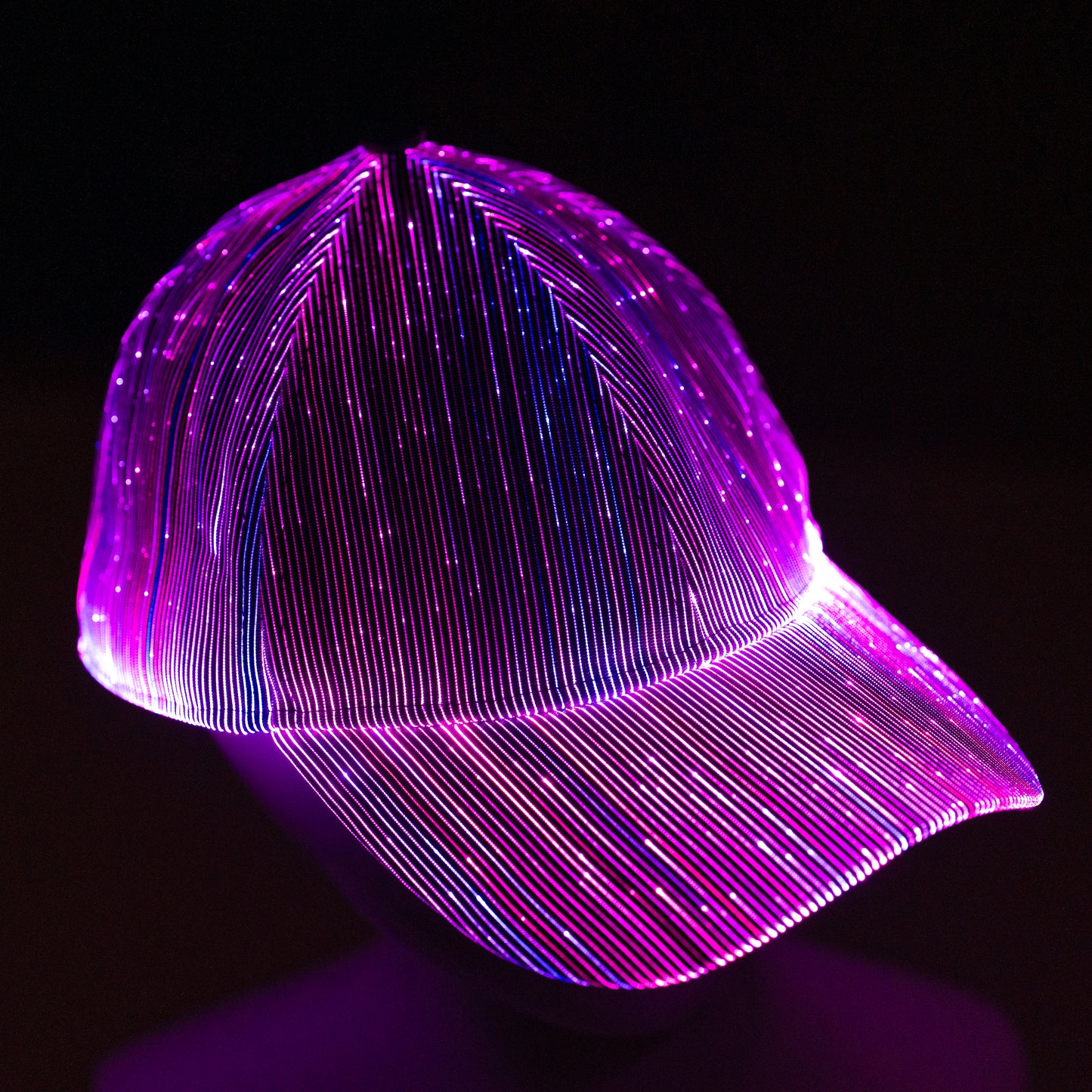 fiber optic LED snapback glowing in bright purple light on a dark background