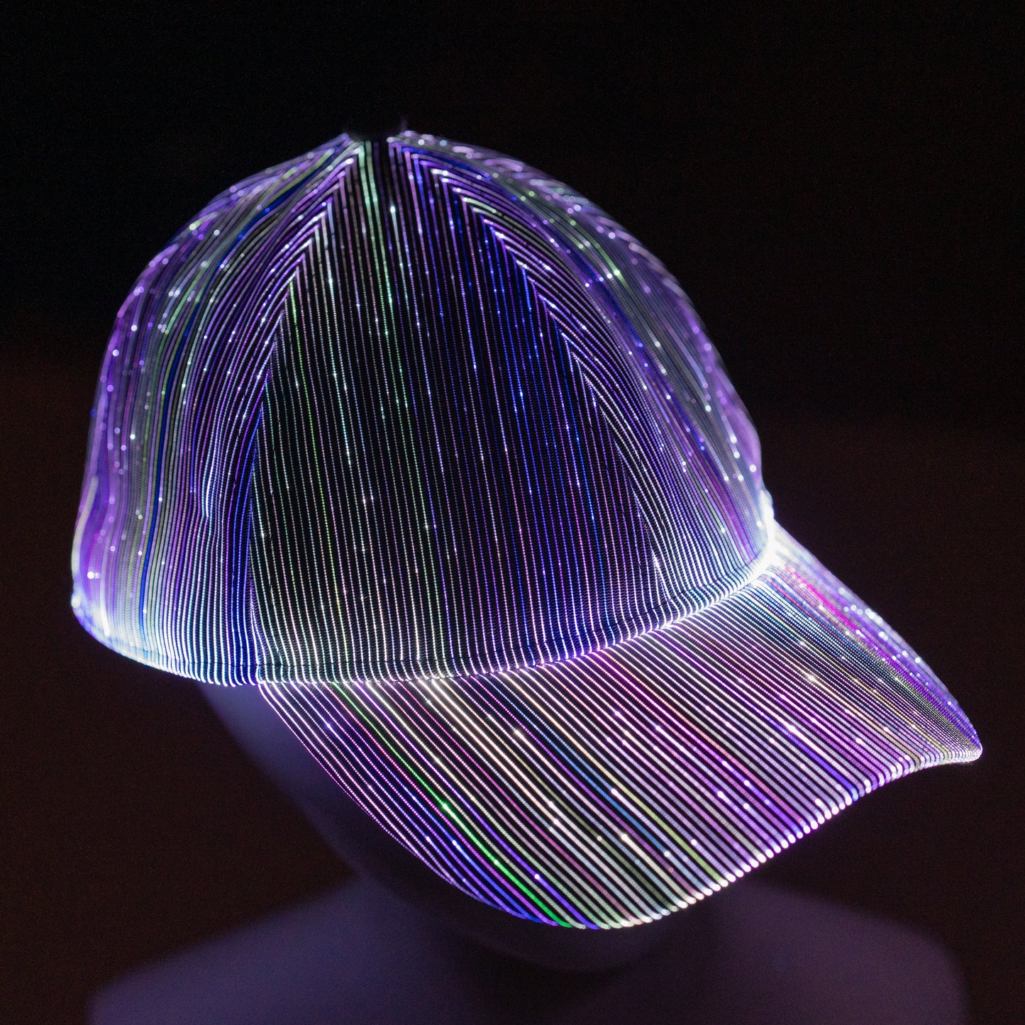 fiber optic LED snapback glowing in bright multicolor light on a dark background