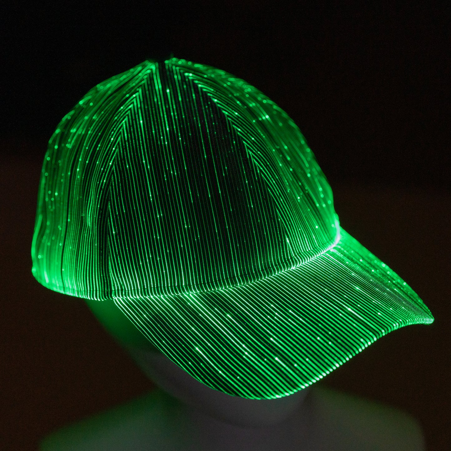 fiber optic LED snapback glowing in bright green light on a dark background