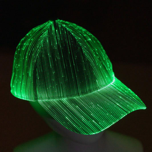 fiber optic LED snapback glowing in bright green light on a dark background