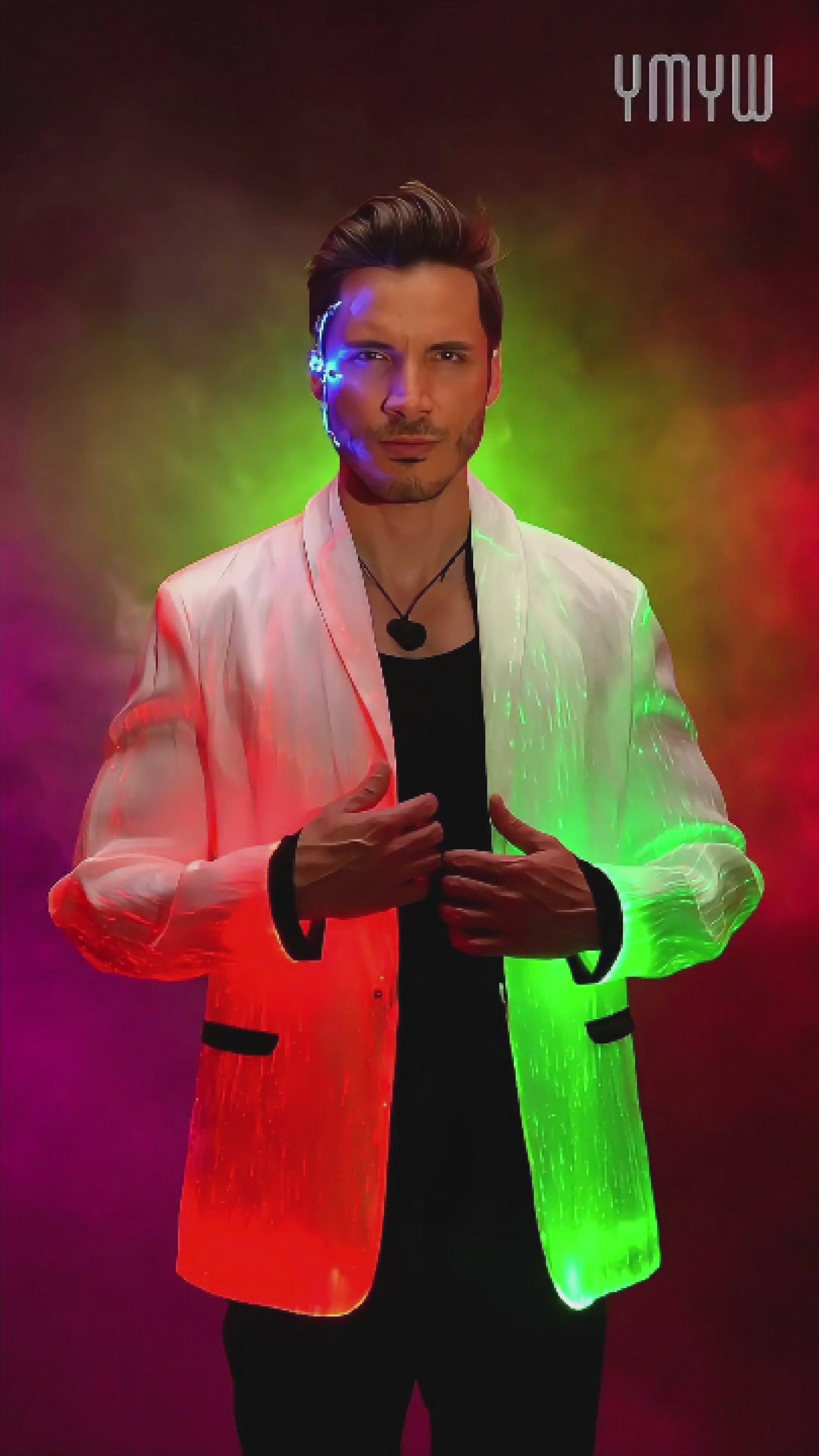 Man wearing a black fiber optic LED suit jacket illuminated in shifting colors, standing against a smoky gradient background. The jacket glows through embedded optic fibers with changing blue, pink, and purple light
