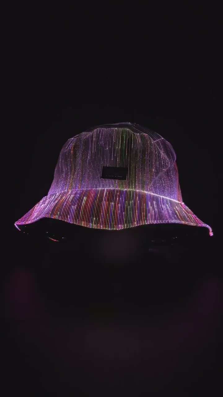 Fiber optic light up bucket hat cycling through vivid multi-color LED modes on a dark background